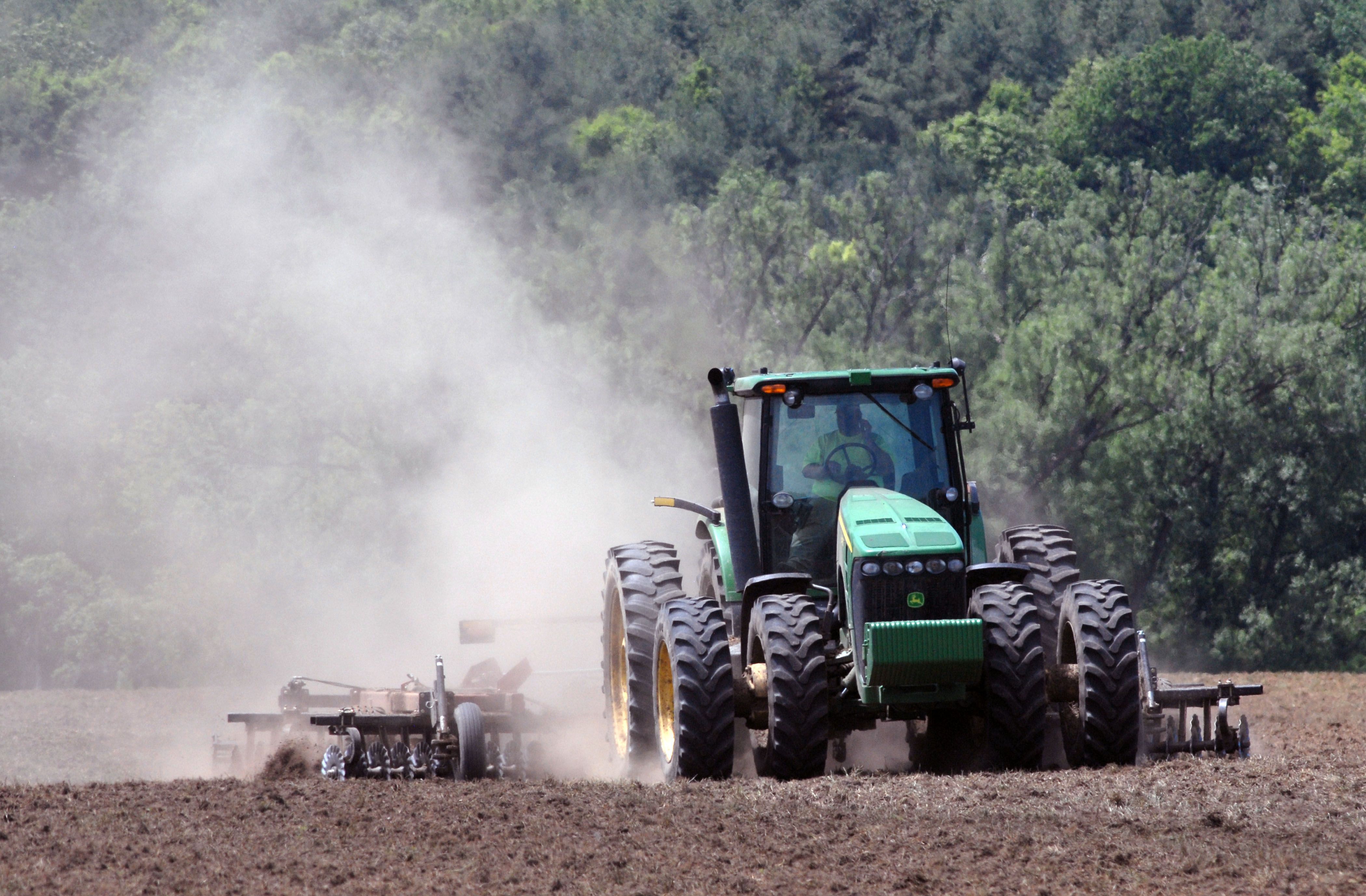 Farm tractor with GPS tracking on field map